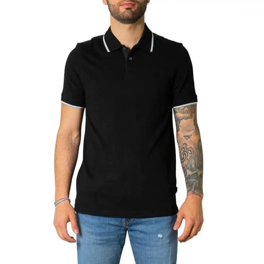 Man in Armani Exchange black polo shirt, epitome of urban style clothing