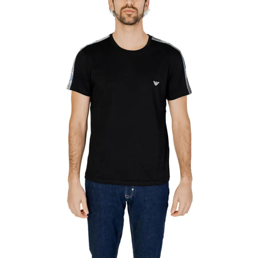 
                      
                        Man in Emporio Armani Underwear black T-shirt and jeans
                      
                    
