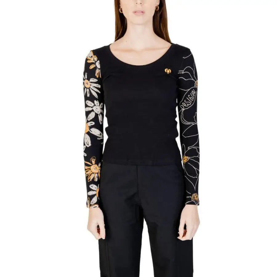 
                      
                        Desigual women wearing black floral embroidered knitwear from Desigual Desigual collection
                      
                    