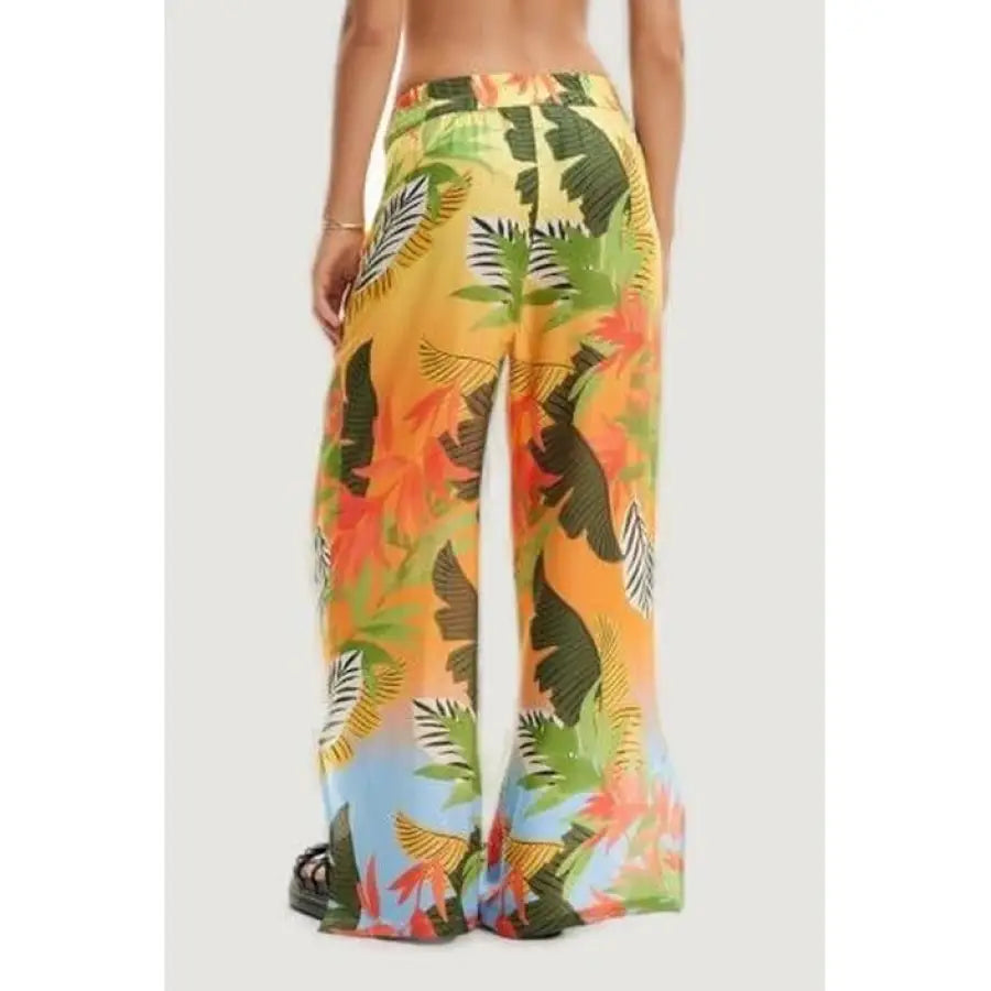 
                      
                        Desigual women in tropical print trousers for urban city style fashion
                      
                    